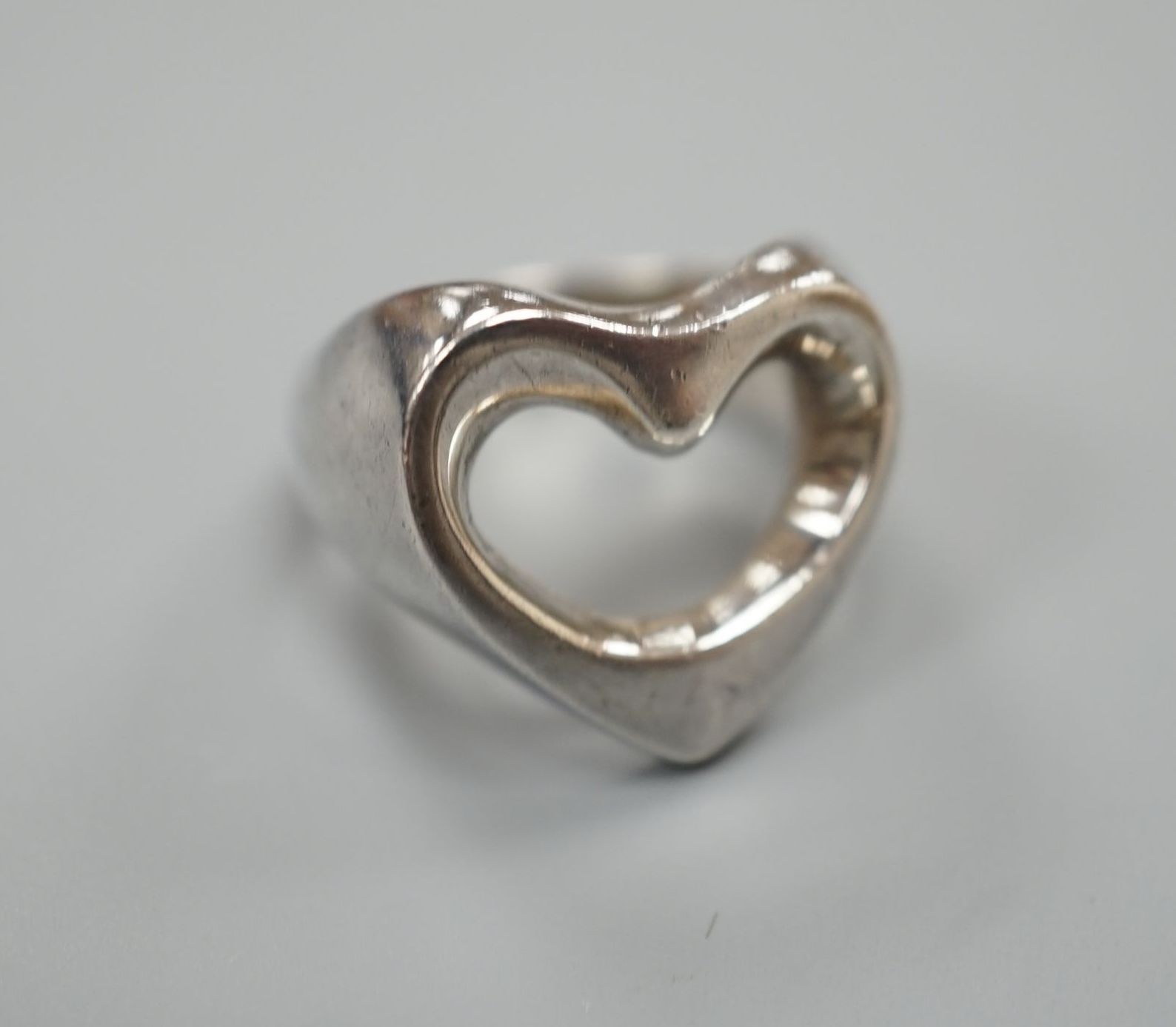 A Georg Jensen sterling pierced heart shaped ring, size M/N, 9.9 grams.